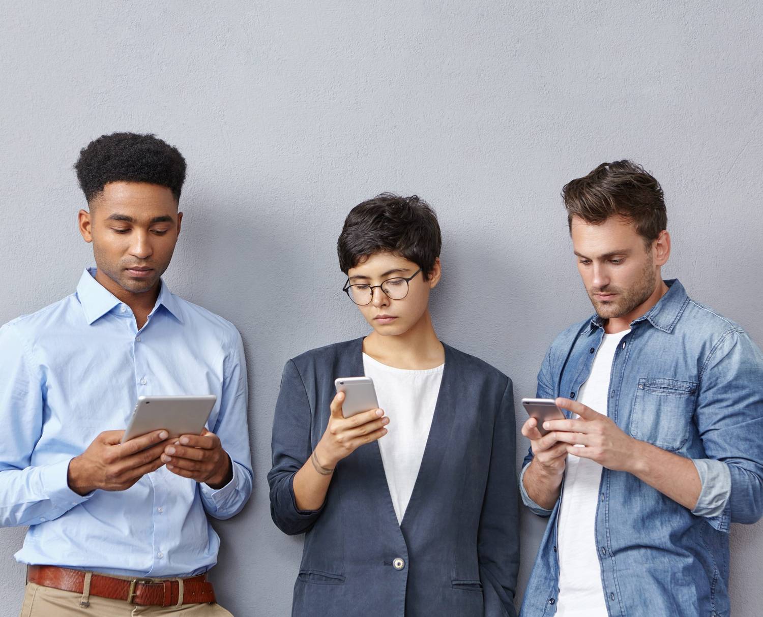 Diverse group of people using smartphones for communication